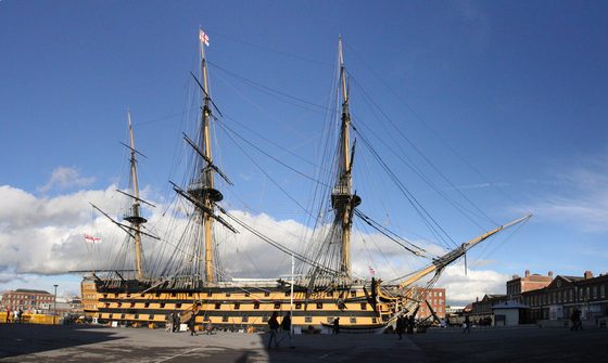HMS Victory seen from the dockside, hull, masts and rigging in full view