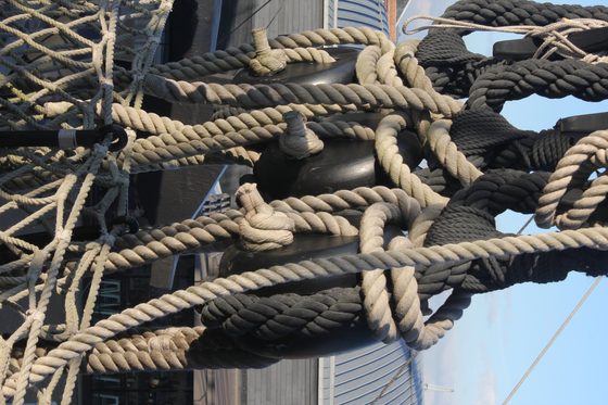 A historic photograph of HMS Victory's topsail showing shot holes